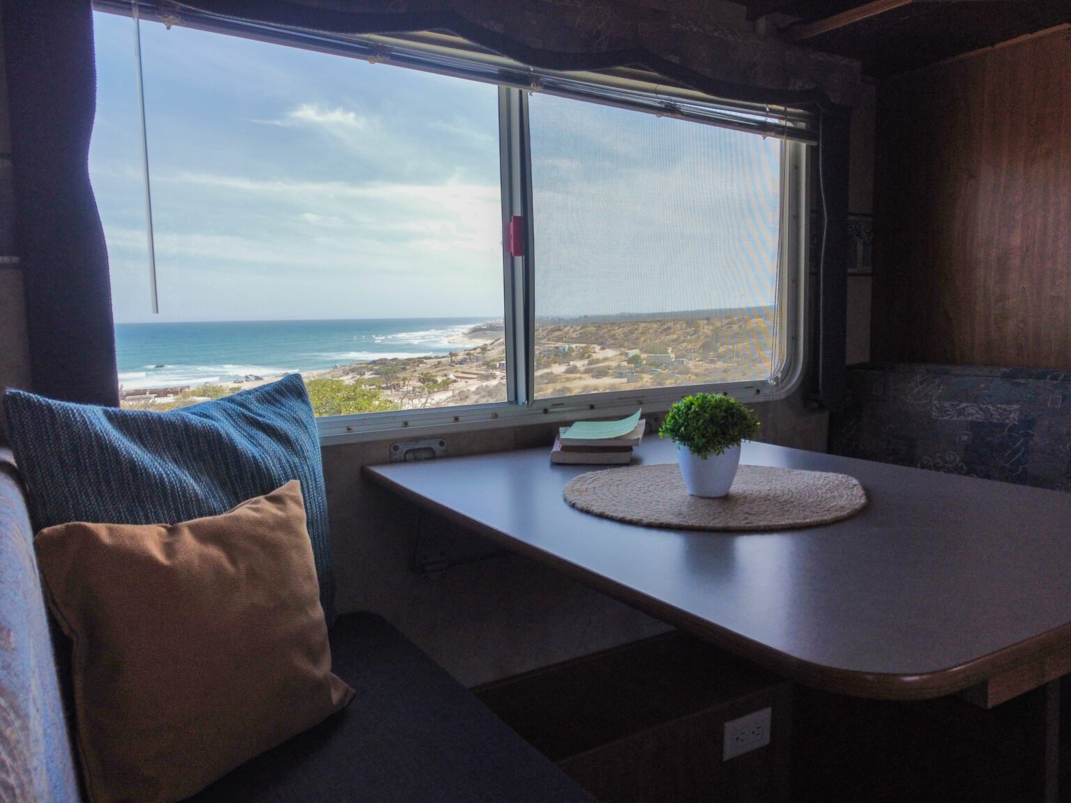 Dining nook inside The Lookout with an ocean view
