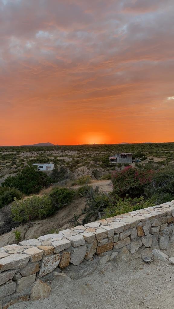 Sunset over the campsites at ALAIA Surf Lodge